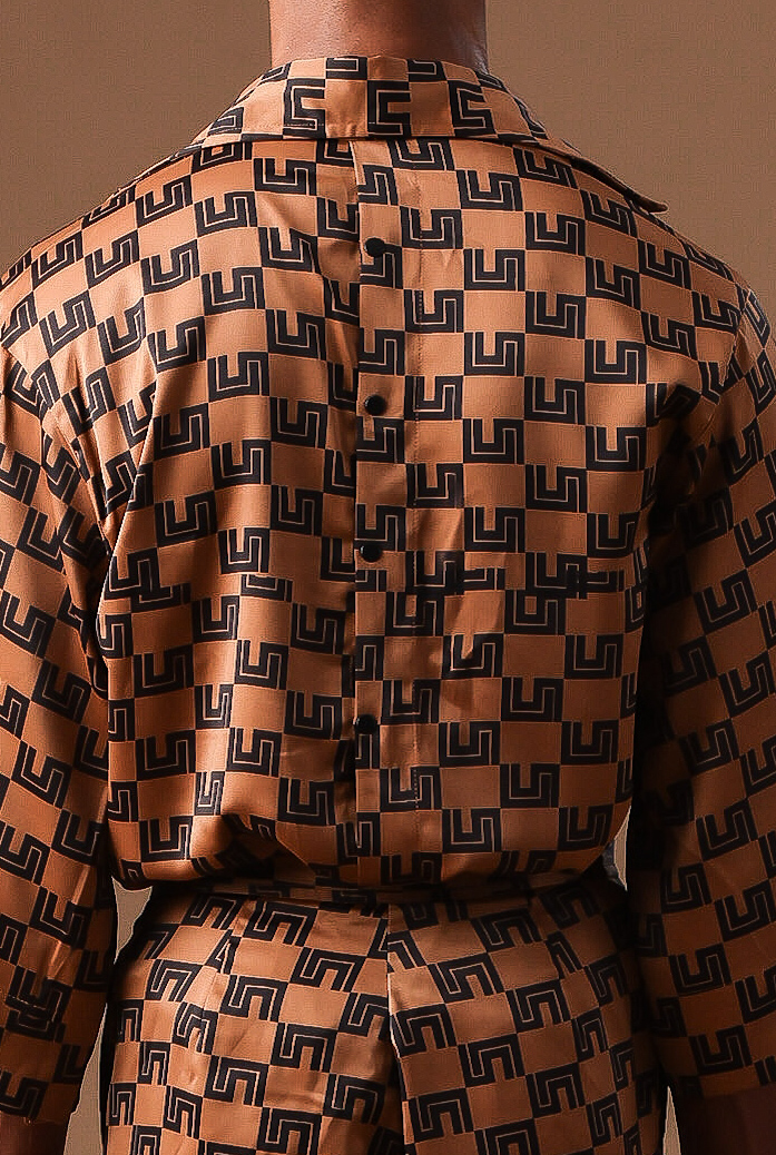 Cute Saint tan monogram-print oversized shirt, matching shorts, and headwrap with sunglasses, Rhythm of Time Collection 2025