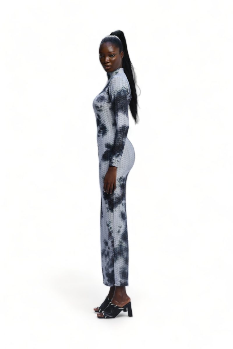 side view of the Apa Dress, a long-sleeved turtleneck maxi dress in a black and white abstract tie-dye print.