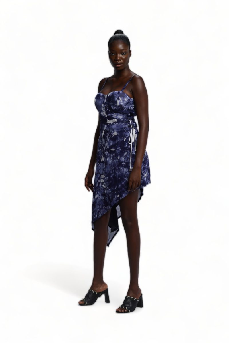 Female Model wearing the Navy and white cloud-print Atunse Dress with an asymmetrical hem.