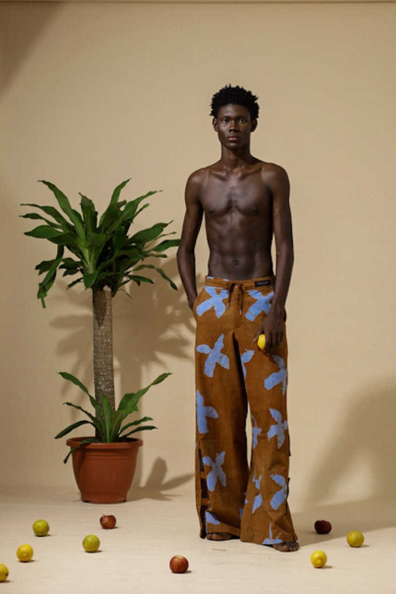 Cute Saint rust orange adire bird-print wide-leg cargo trousers, Irin-Ajo Resort 2025