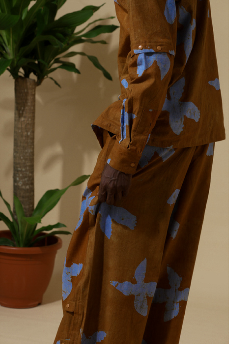 Cute Saint rust orange adire bird-print wide-leg cargo trousers, Irin-Ajo Resort 2025