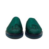 Front-facing view of Bata Mules in teal green textile featuring a black embroidered graphic logo on the toe