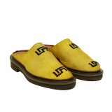 Angled view of Bata Mules in yellow textile with a black graphic logo on the side and a brown layered sole.